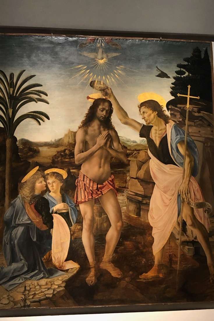 Planning a trip to Italy -Painting of Jesus with angels and a holy person at the UIffizi Museum in Florence